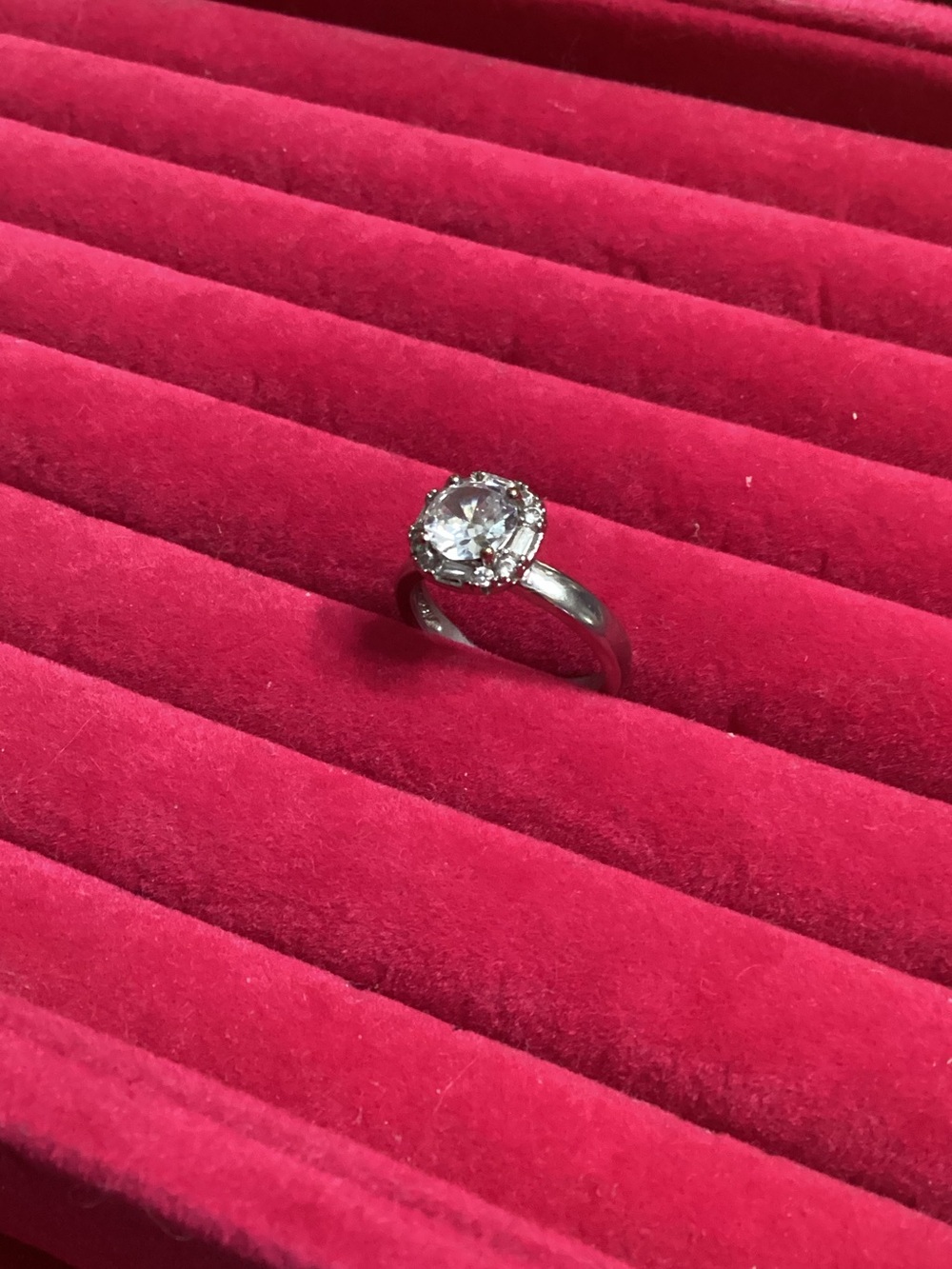 New SS/925 & Moissanite center stone w/several small stones around it size 6